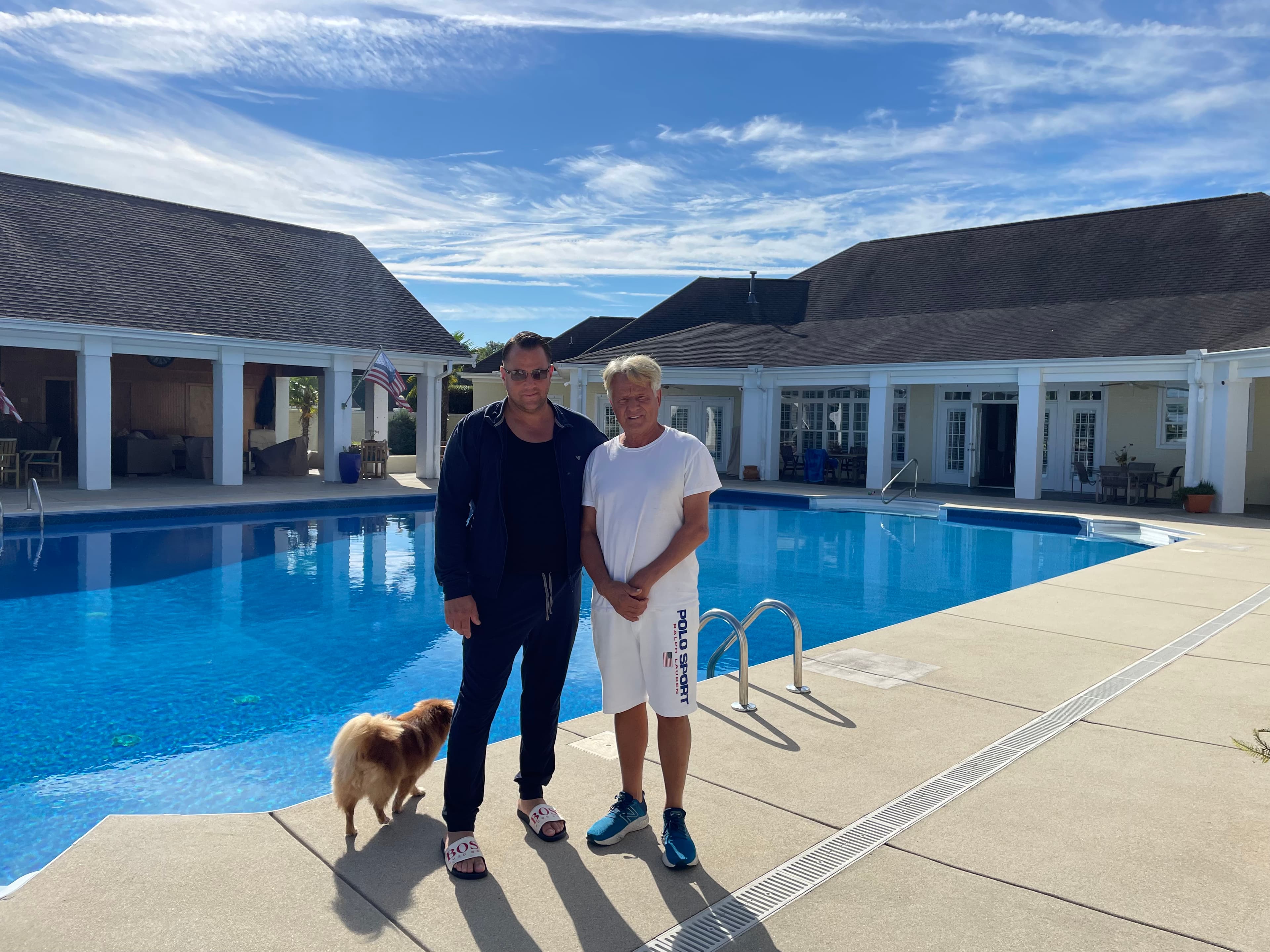 John Camiola with a friend at his estate pool